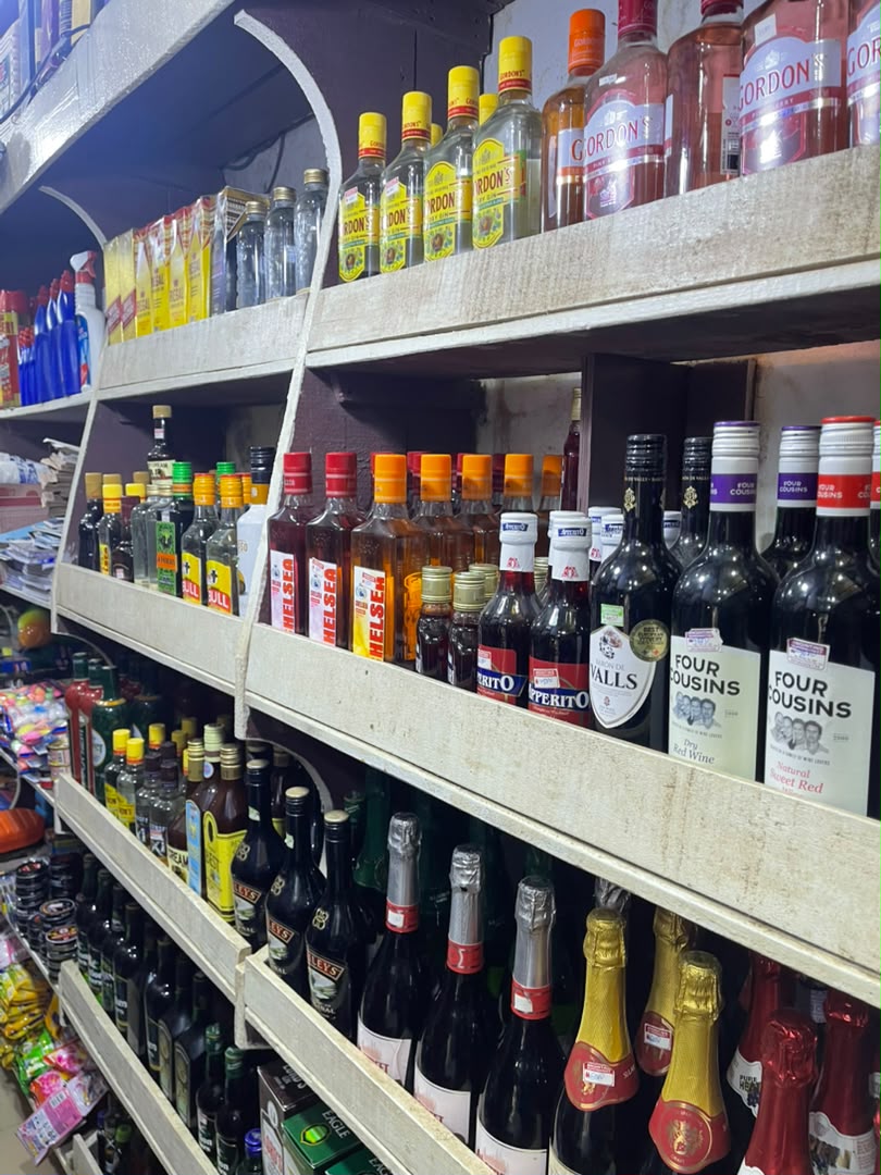 Shelves of gin, wine and sparkling wine bottles