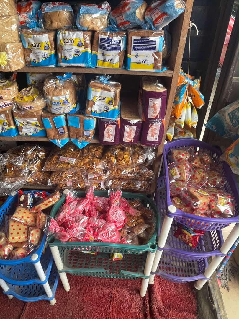 Bread shelf with baskets of snacks and confectionery